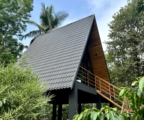 Guest relaxing by the pool at Cascara resort in Wayanad